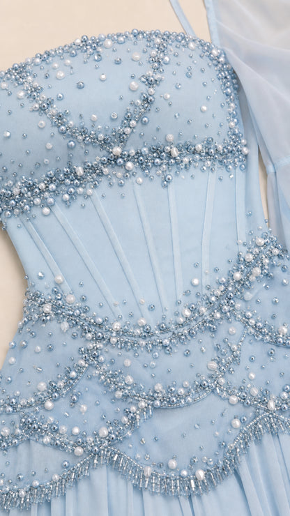 Close-up detail of pearl and bead embellishments on the bodice