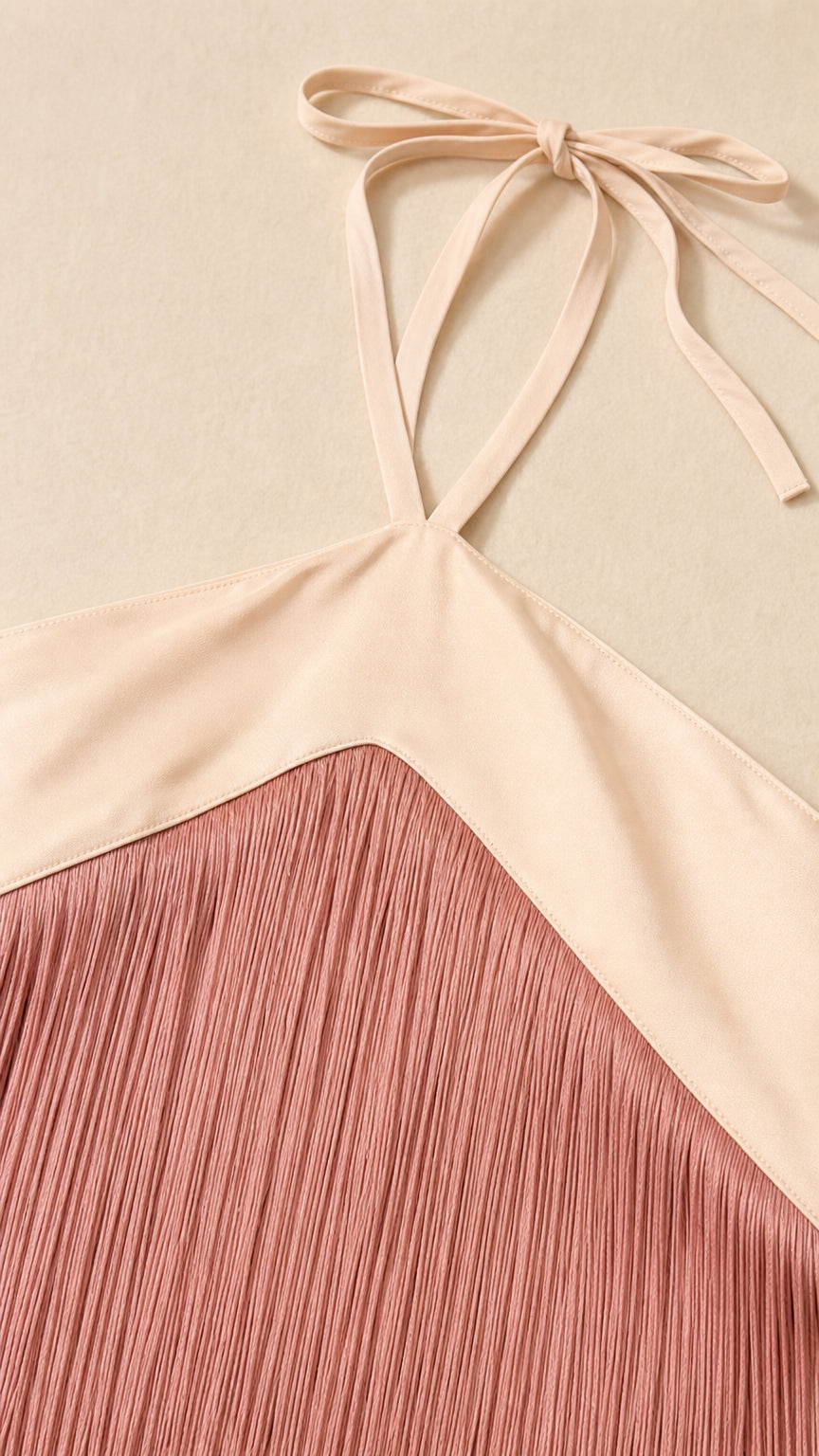 Close-up detail of halter neckline strap and delicate fringe trim texture