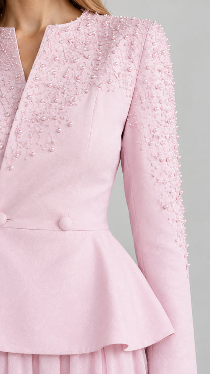 Close-up of pearl bead embellishment on Blush Pink peplum top shoulder and neckline