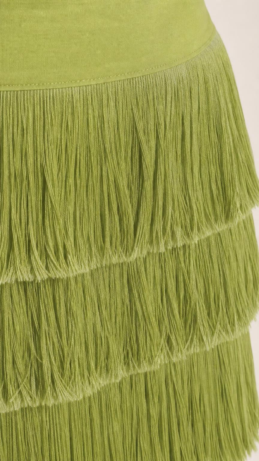 Close up view of the fringe tiers on the olive green dress