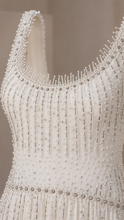 Close-up detail of beaded scoop neckline
