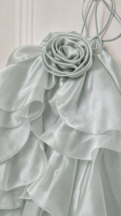 Close-up detail of the 3d fabric rosette and cascading ruffles