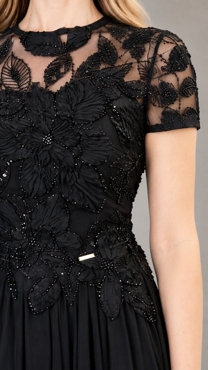 Close-up of black beaded floral lace bodice and illusion neckline