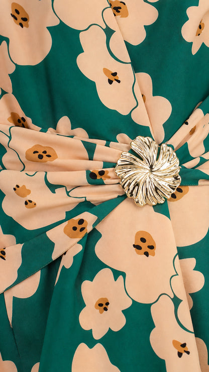 Close-up of waist buckle and floral print