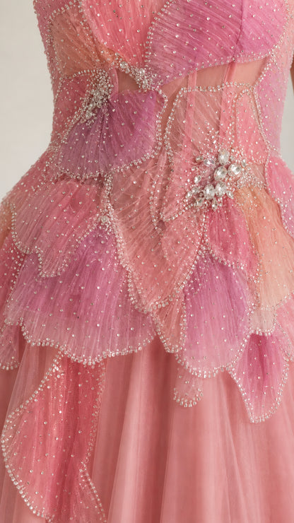 Close-up detail of blush pink beaded petal bodice with crystal embellishments