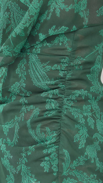 Close-up detail of green botanical jacquard fabric texture and side gathering