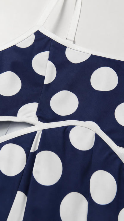 Close up of neckline and strap detail of polka dot dress