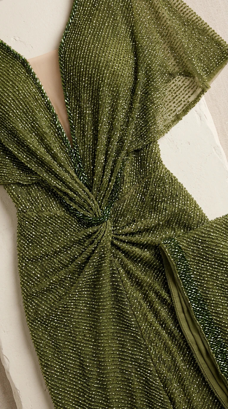 Close-up detail of textured shimmer fabric and center-front twist waist knot
