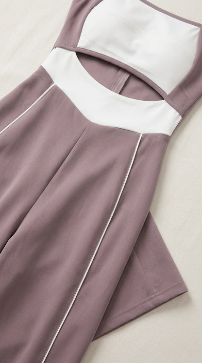 Close-up detail of cutout waist, contrast white panels, and side piping