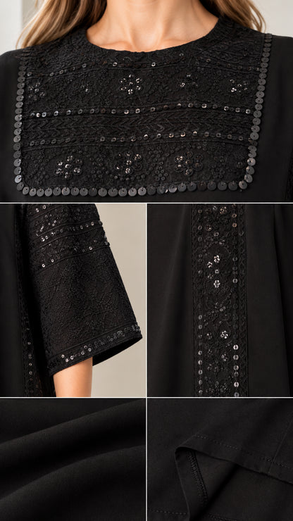 Close-up details of sequin embroidery on neckline, sleeve cuffs, and side trim of black dress