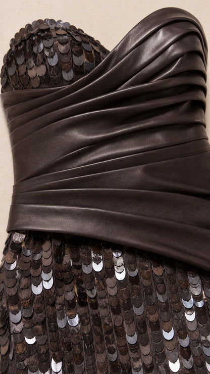 Close-up detail of draped ruched bodice and shimmering sequin paillettes