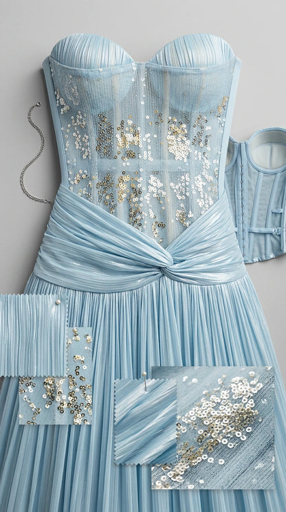 Close-up detail of light blue sequined boned sweetheart bodice and pleated fabric swatches