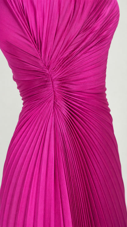Close-up detail of gathered waist and pleating on fuchsia evening dress