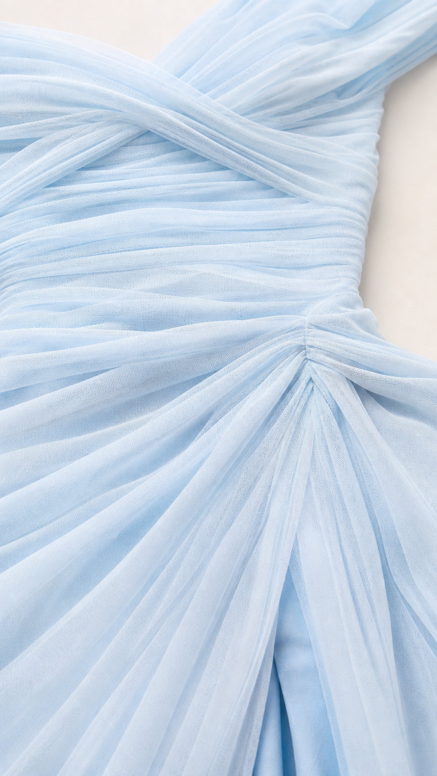 Close-up of soft sky blue pleated tulle fabric and ruched bodice details