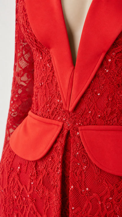 Close-up detail of the satin lapel and textured red lace