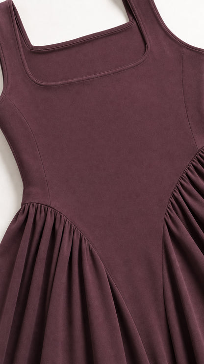 Close-up of square neckline and fitted bodice on burgundy dress