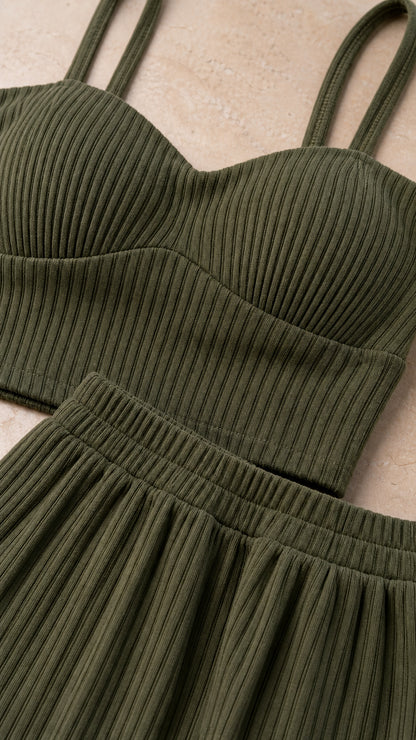 Close-up of olive ribbed fabric on cami crop top and skirt waistband