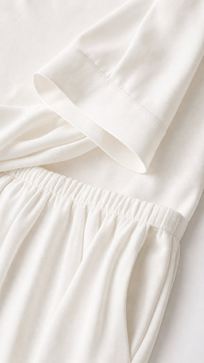 Close-up detail of white top cuff and elastic waistband