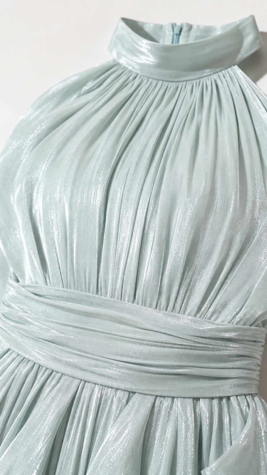 Close-up detail of high collar and pleated bodice in sage green