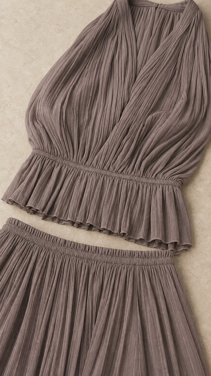Flat lay close-up of taupe pleated fabric details