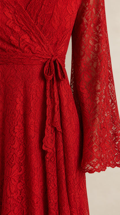 Close-up detail of red floral lace pattern and waist tie sash