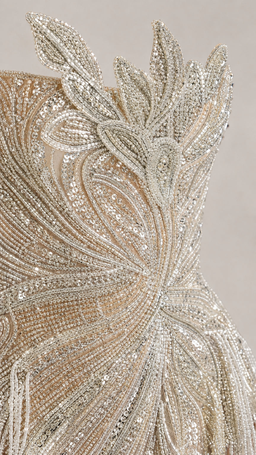 Close-up detail of silver sequin and bead floral embellishments