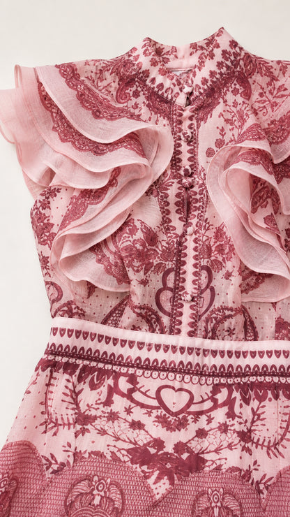 Close-up of ruffle shoulder and patterned bodice detail