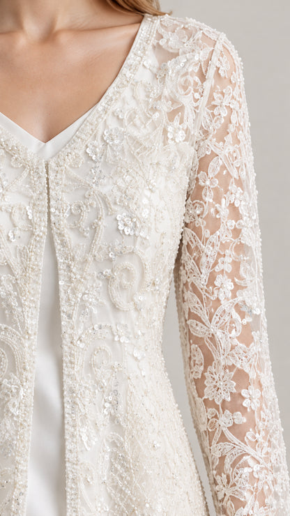 Close-up detail of Ivory floral lace embroidery and sequin accents