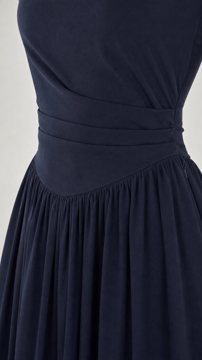 Close-up detail of pleated waistband on Navy chiffon dress