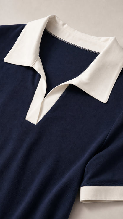 Close-up detail of white contrast polo collar and soft jersey knit fabric