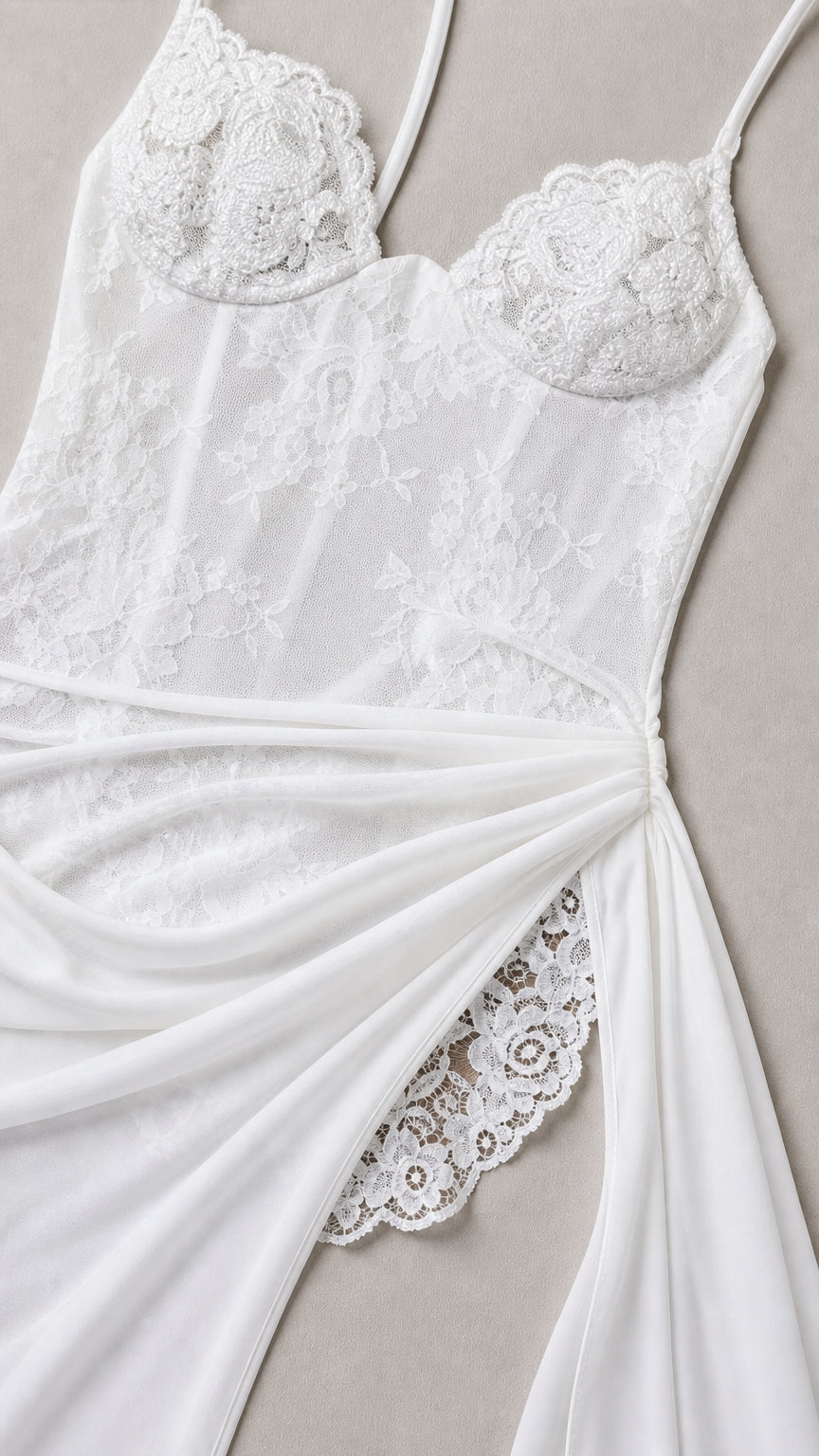 Close-up detail of white lace corset bodice and draped thigh slit accent