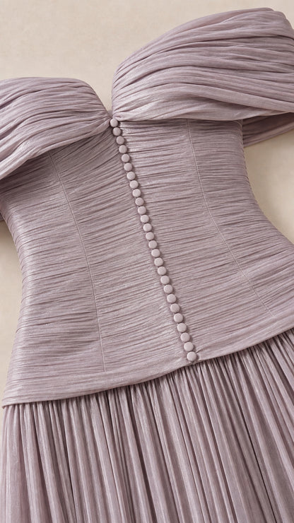 Close-up of ruched bodice and decorative buttons in lavender