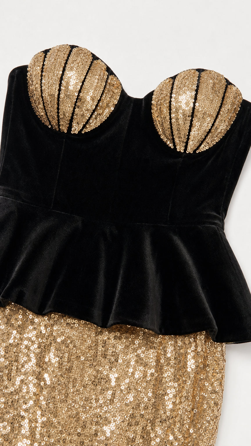 Close-up of gold shell bust and black velvet peplum