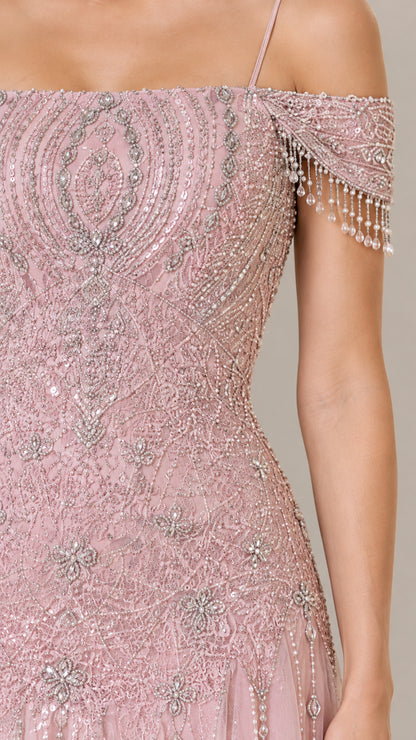 Close-up detail of beaded embroidery and fringe sleeve trim