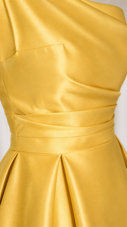Close-up of pleated bodice and waistband on yellow satin dress