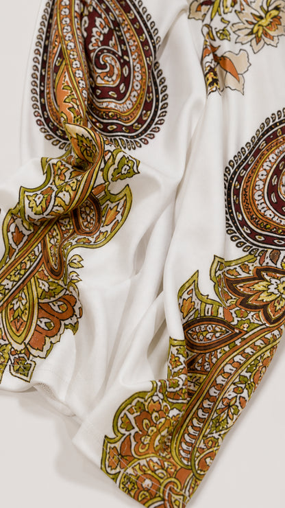 Close-up of smooth fabric texture and paisley pattern