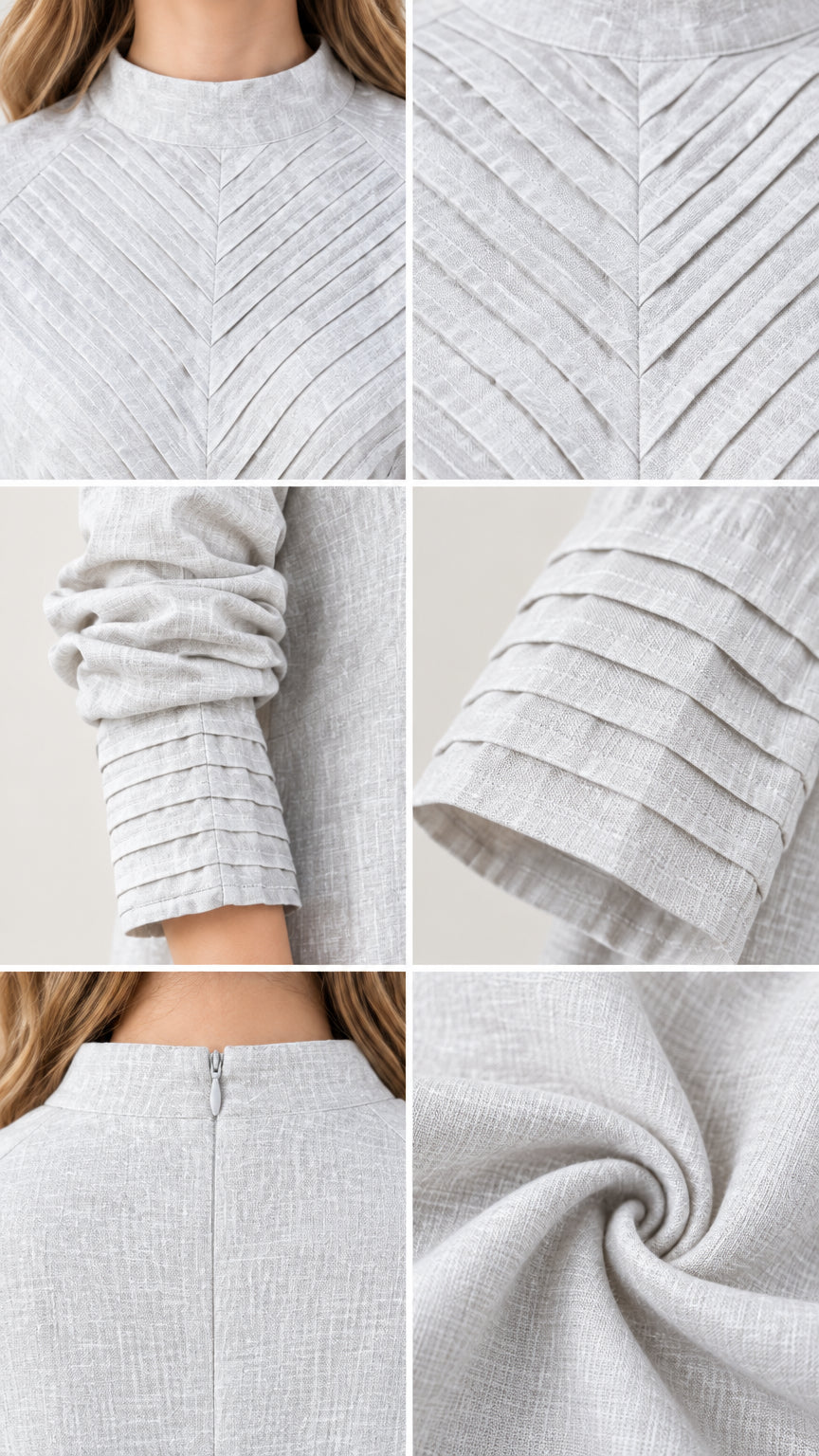 Close-up details of chest chevron pleating, pleated cuff, zip, and woven fabric texture