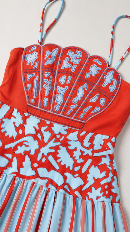 Close-up detail of seashell embroidery and straps