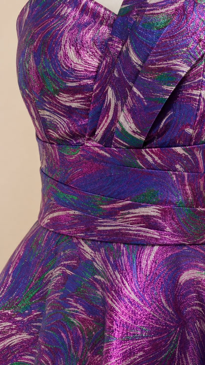 Close-up of pleated bodice and waistband on metallic evening gown
