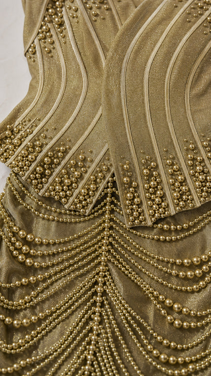 Close-up detail of bodice and beaded fringe