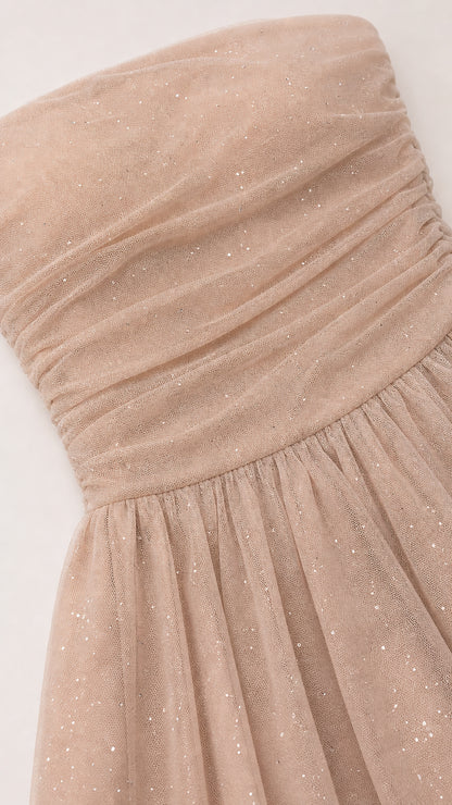 Close-up detail of ruched bodice and glitter mesh texture
