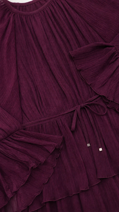 Close up of textured crinkle plissé fabric with ruffled tiers and drawstring waist detail