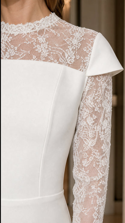 Close-up detail of sheer floral lace yoke, mock neckline, and structured shoulder caps
