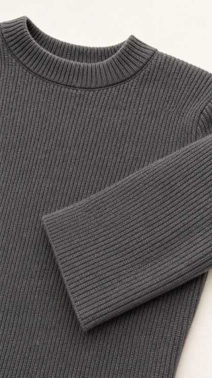 Close-up detail of charcoal grey ribbed knit neckline and sleeve cuff texture