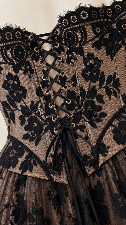 Close up of lace-up corset back detail on dress