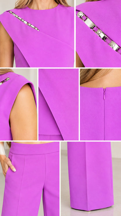 Close-up details of metallic chain accent, asymmetric neckline, concealed zipper, and pocket seams