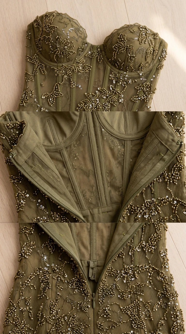 Close-up detail of sweetheart neckline, beadwork, interior corset boning, and zipper