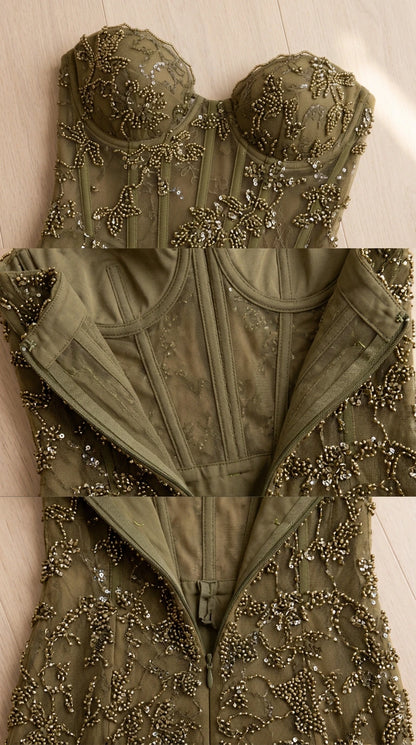 Close-up detail of sweetheart neckline, beadwork, interior corset boning, and zipper