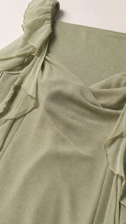 Close-up fabric texture and shoulder detail of sage green dress