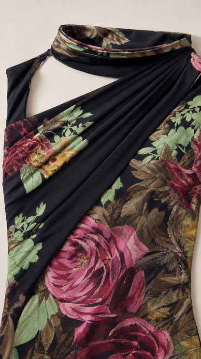 Close up of ruched bodice and high neck detail on black floral gown